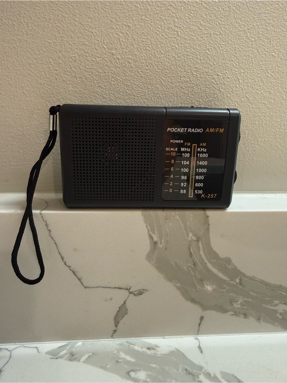 AM/FM K-257 Pocket Radio with antenna and headphone jack